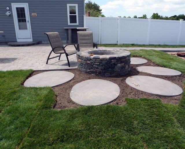 Fire pit with concrete pad for seating